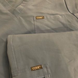 Women code next baby blue scrubs (top and bottom)